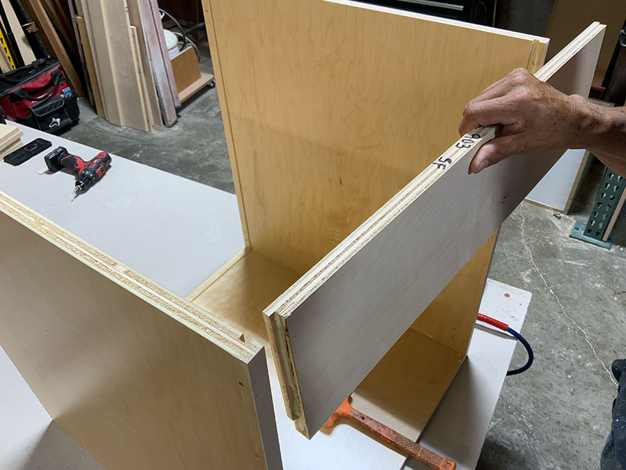 Close-up of a lock dado joint in cabinet box construction